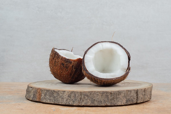 half-cut-ripe-coconuts-wood-piece